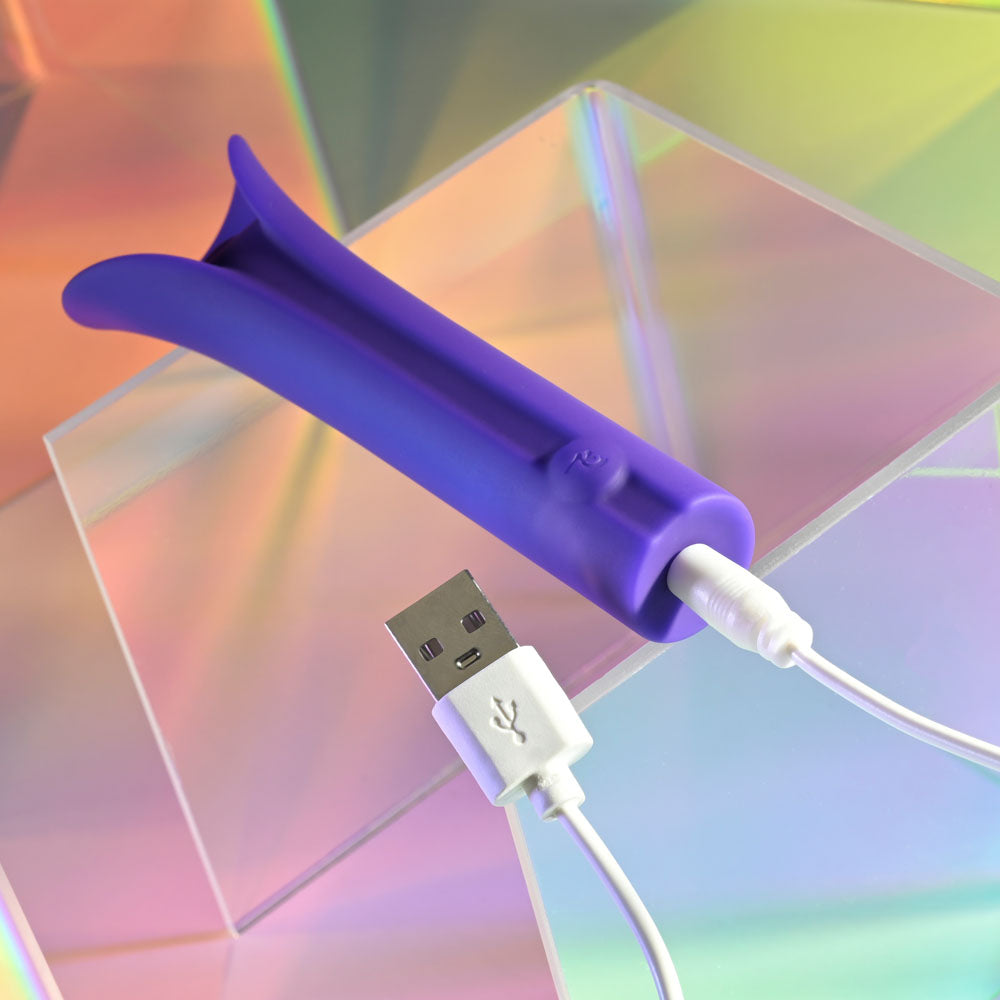 Evolved FULL COVERAGE - 11.9 cm USB Rechargeable Bullet charging with USB cable on a colorful background.