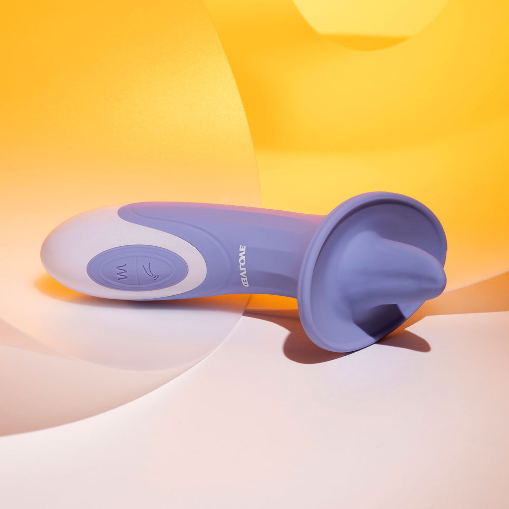 Evolved LIX & KISSES USB rechargeable tongue stimulator on a colorful background.
