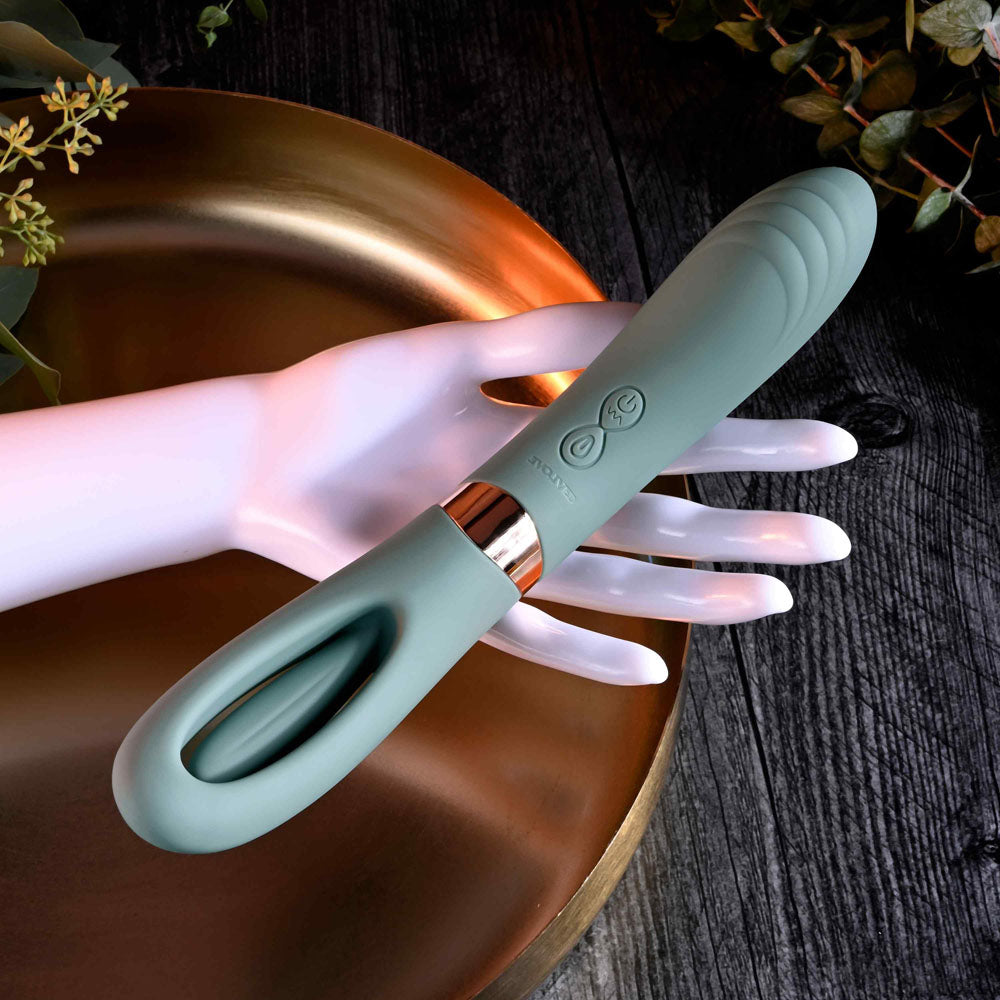 Evolved CHICK FLICK - Olive 24 cm USB Rechargeable Vibrator with Flicking Tip displayed on a stylish hand.