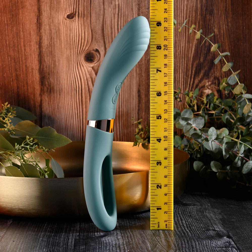 Evolved CHICK FLICK - Olive 24 cm USB Rechargeable Vibrator with Flicking Tip next to a measuring tape for scale.
