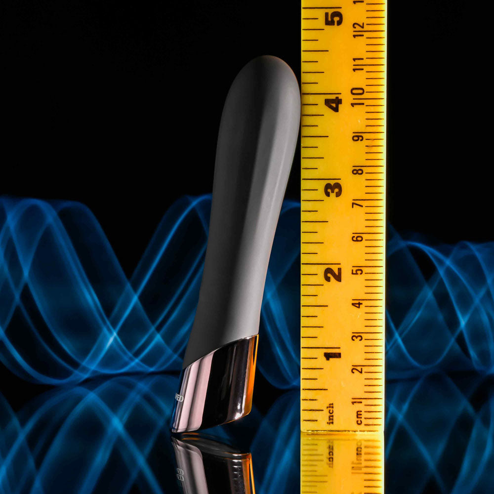 Evolved BACK IN  -  11.9 cm USB Rechargeable Bullet next to a measuring tape for size reference.