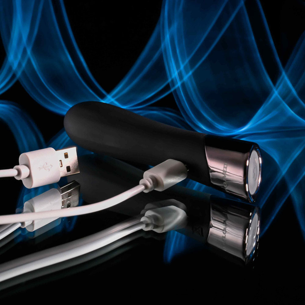 Evolved BACK IN  -  11.9 cm USB Rechargeable Bullet on reflective surface with USB charging cable.