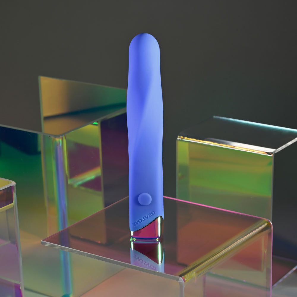 Evolved TWISTED TEMPTATION - 12 cm USB Rechargeable Bullet on a colorful background with reflection.