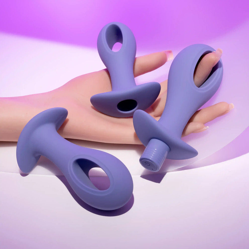 Evolved HOLE PUNCH PLUG SET -  Butt Plugs with Interchangeable Bullet - Set of 3 Sizes on a sleek display.