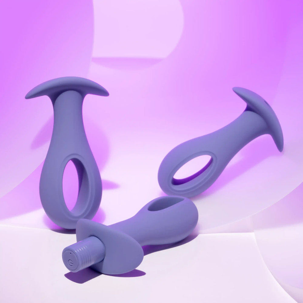 Evolved HOLE PUNCH PLUG SET -  Butt Plugs with Interchangeable Bullet - Set of 3 Sizes on a purple background.