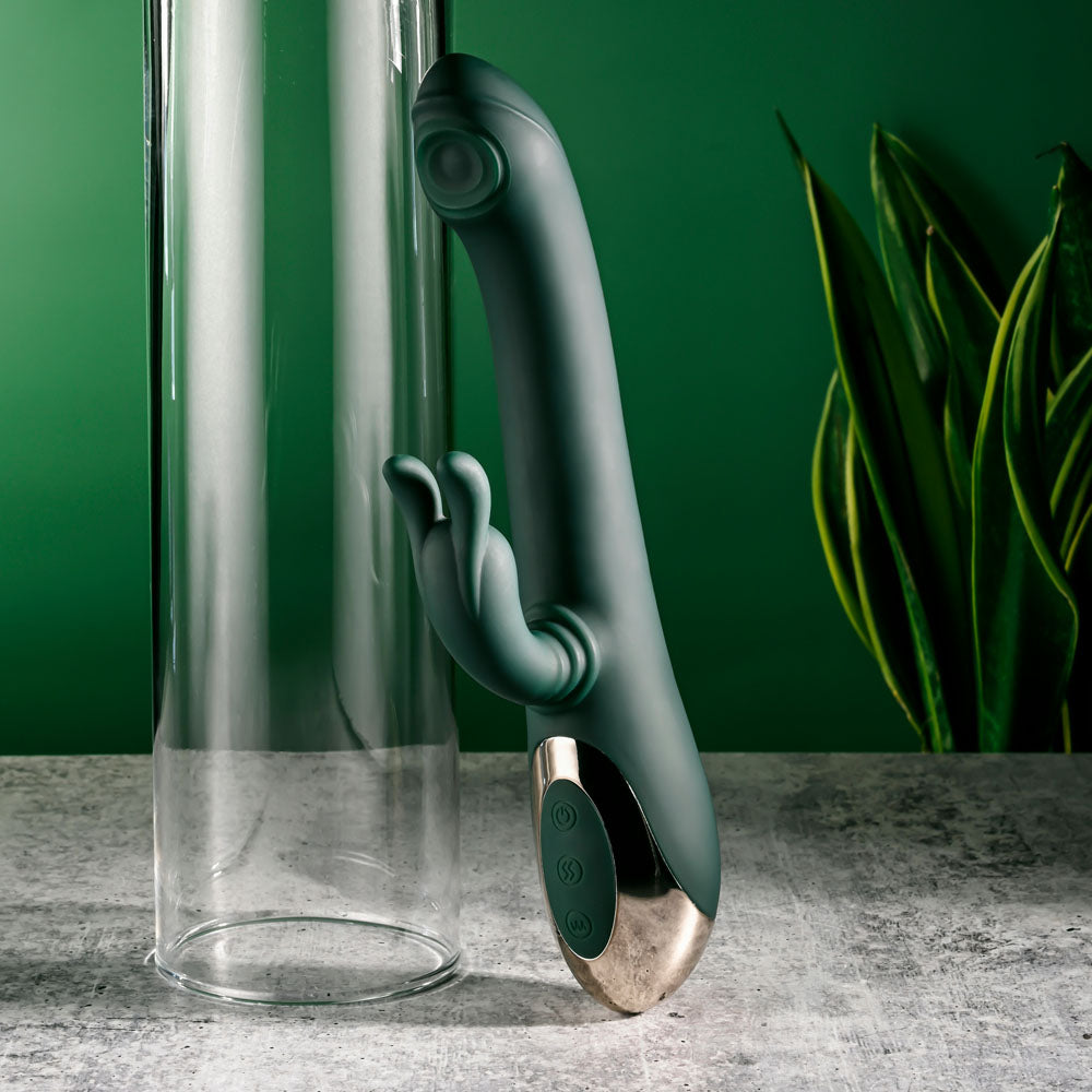 Evolved RABBIT TAP TAP - 25 cm USB Rechargeable Rabbit Vibrator with Tapping Tip against a green background.