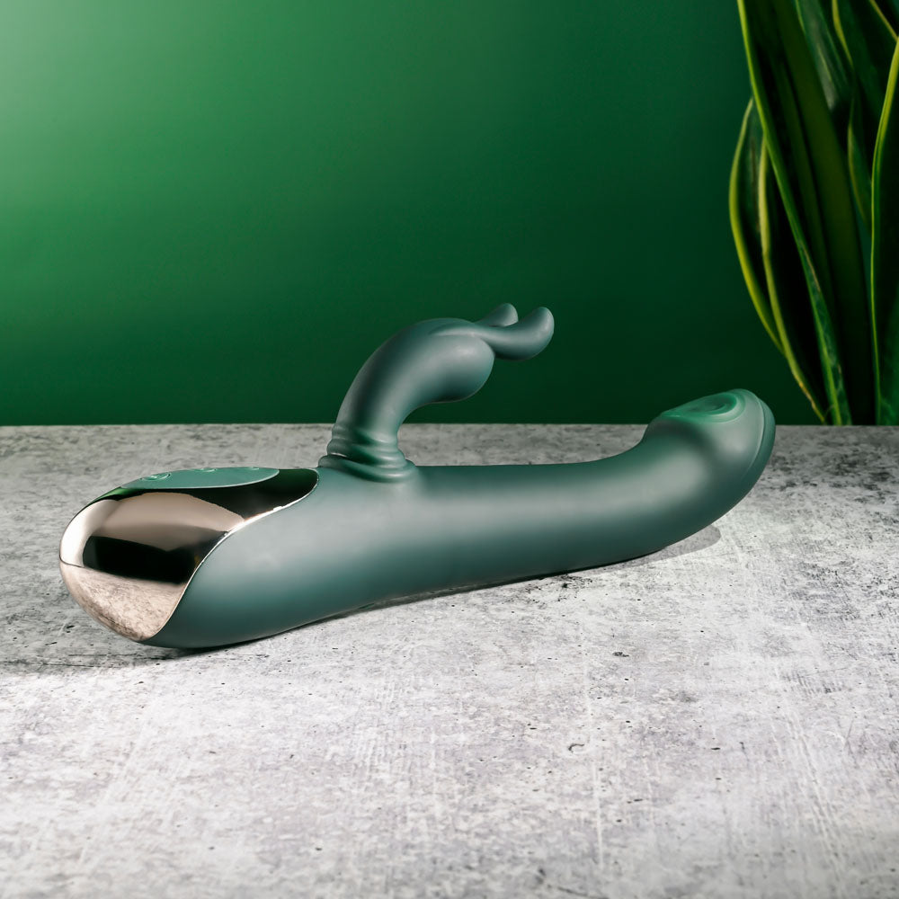 Evolved RABBIT TAP TAP - 25 cm USB Rechargeable Rabbit Vibrator with Tapping Tip on a textured surface.