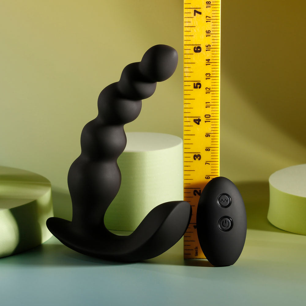 Evolved BEAD ME UP -  16.8 cm USB Rechargeable Vibrating Anal Beads with Wireless Remote alongside a ruler for size reference.