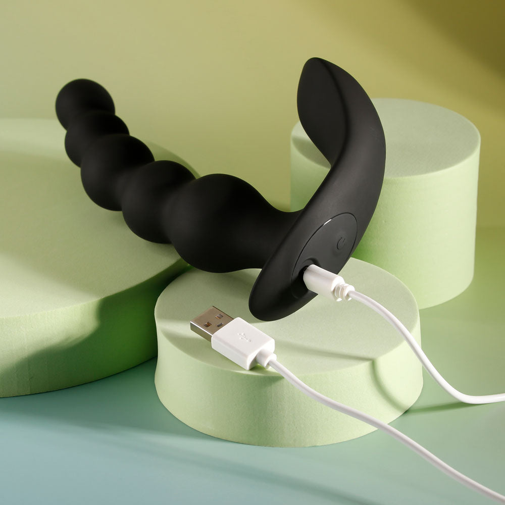 Evolved BEAD ME UP -  16.8 cm USB Rechargeable Vibrating Anal Beads with Wireless Remote on pastel platforms.