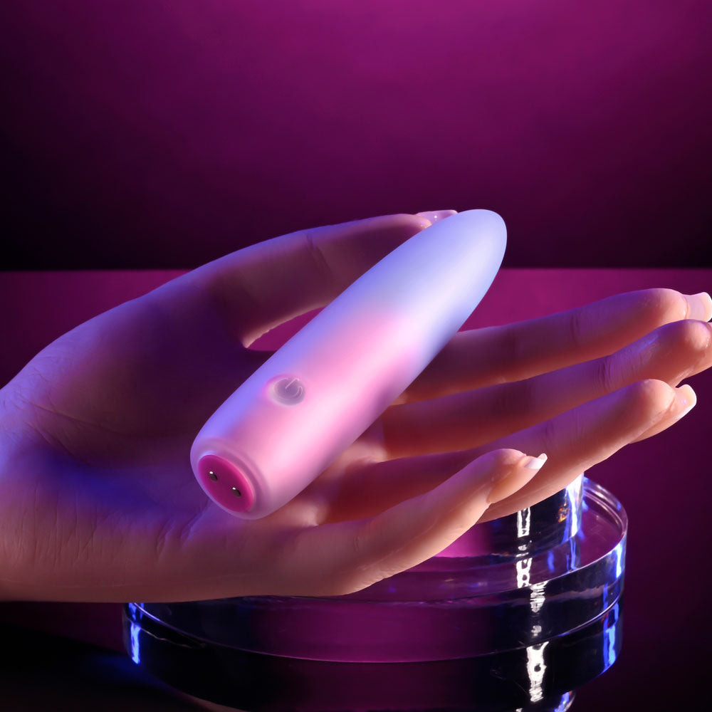 Evolved PARADISE BULLET - Pink/Purple 10.2 cm USB Rechargeable Bullet showcased in hand with vibrant lighting.