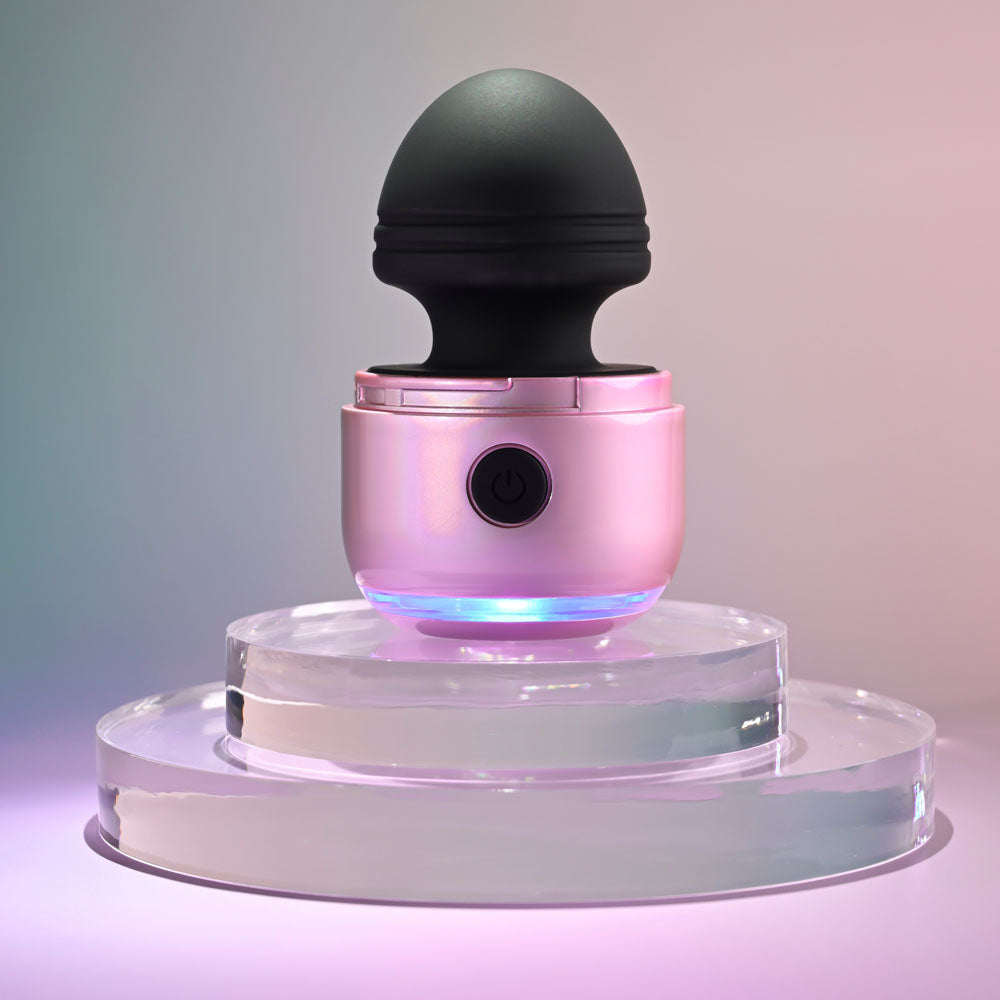 Evolved VACATION VIBES - VIBRATING - /Black 8.5 cm USB Rechargeable Vibrating Stimulator on a display pedestal.