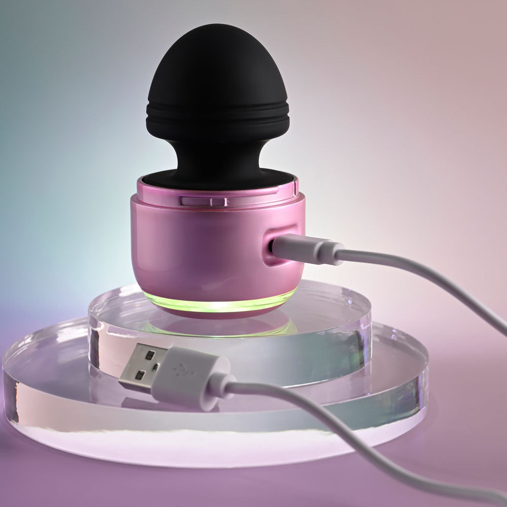 Evolved VACATION VIBES - VIBRATING - /Black 8.5 cm USB Rechargeable Vibrating Stimulator on charging base.