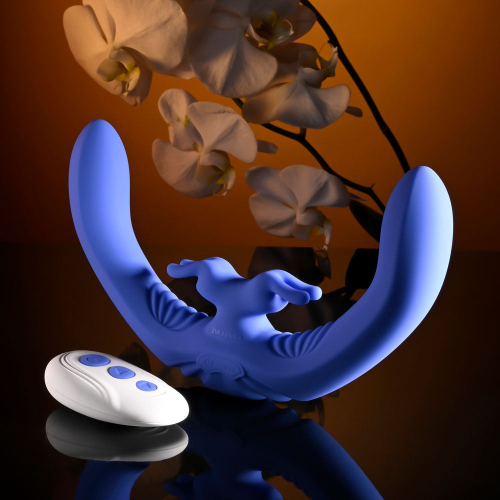 Evolved LOVEBIRDS -  20.8 cm USB Rechargeable Double-Ended Rabbit Vibrator with Remote next to a remote and orchids.