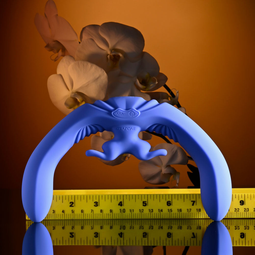 Evolved LOVEBIRDS - 20.8 cm USB Rechargeable Double-Ended Rabbit Vibrator with Remote against a floral background.