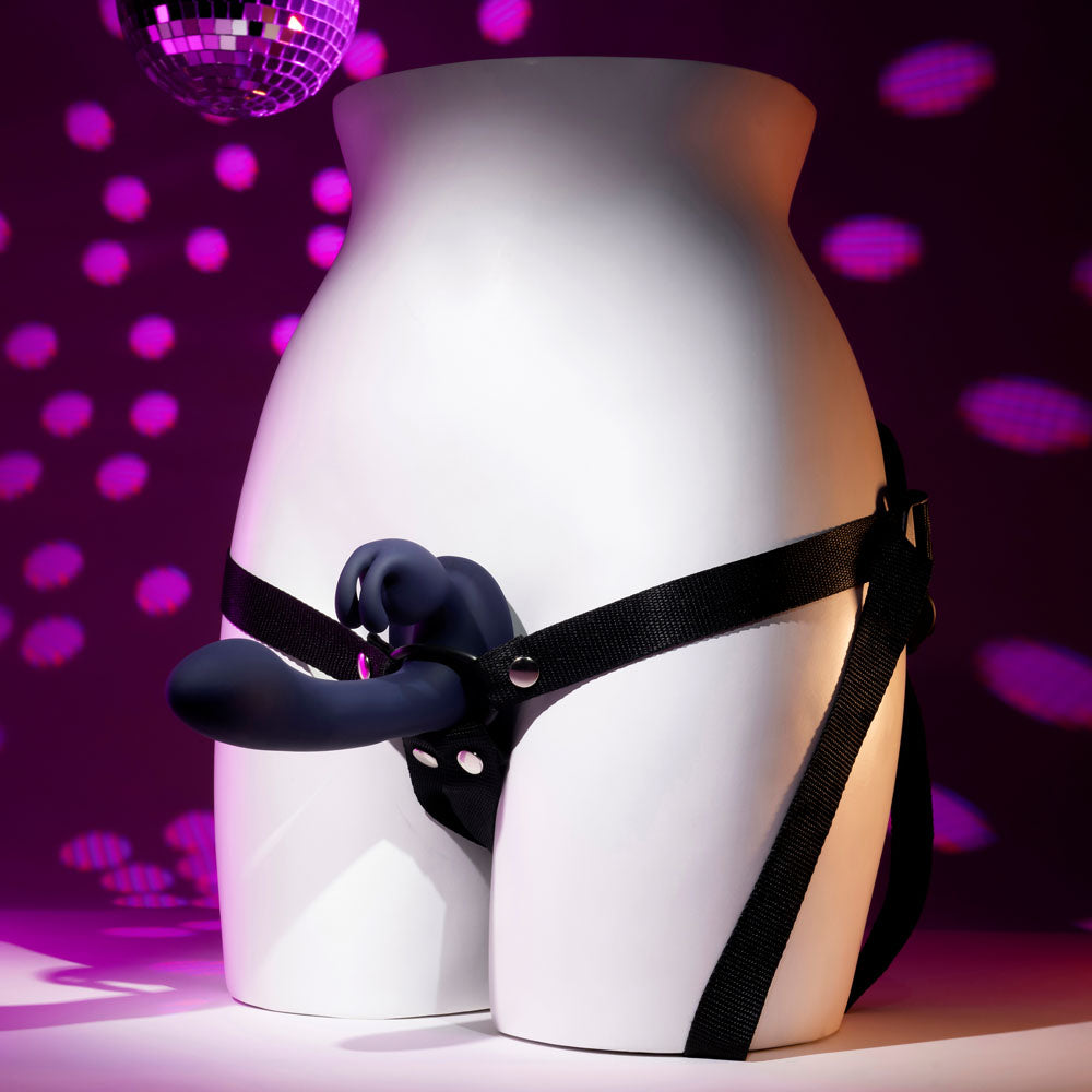 Evolved GIVING VIBES - 14.6 cm USB rechargeable vibrating strap-on with remote displayed on a mannequin.