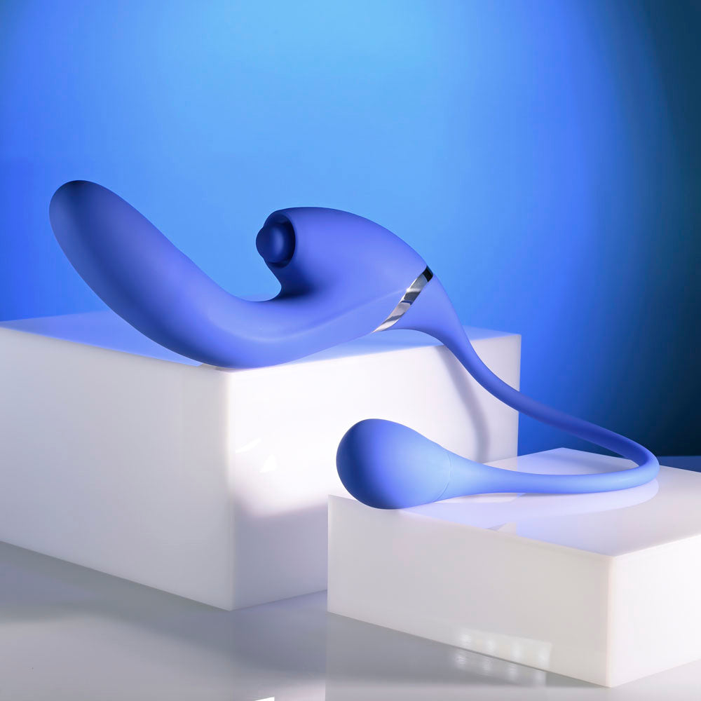 Evolved ALL IN -  USB Recahrgeable Triple Stimulating Vibrator displayed on a white pedestal with a blue background.