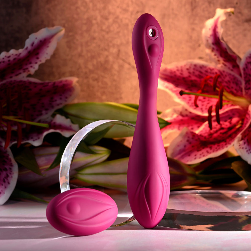 Evolved CHERRY POSE -  16.1 cm USB Rechargeable Flexible & Posable Vibrator with Remote among pink flowers.