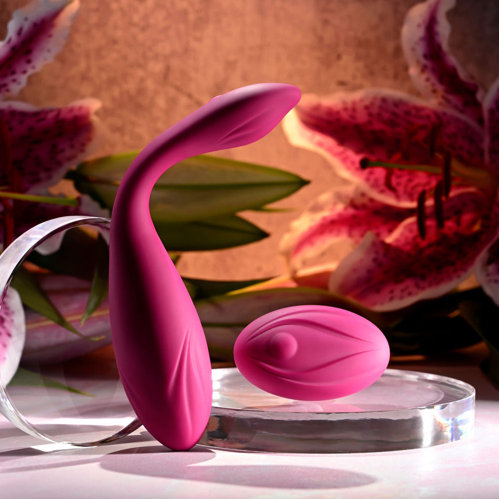 Evolved CHERRY POSE -  16.1 cm USB Rechargeable Flexible & Posable Vibrator with Remote next to a pink egg vibrator.
