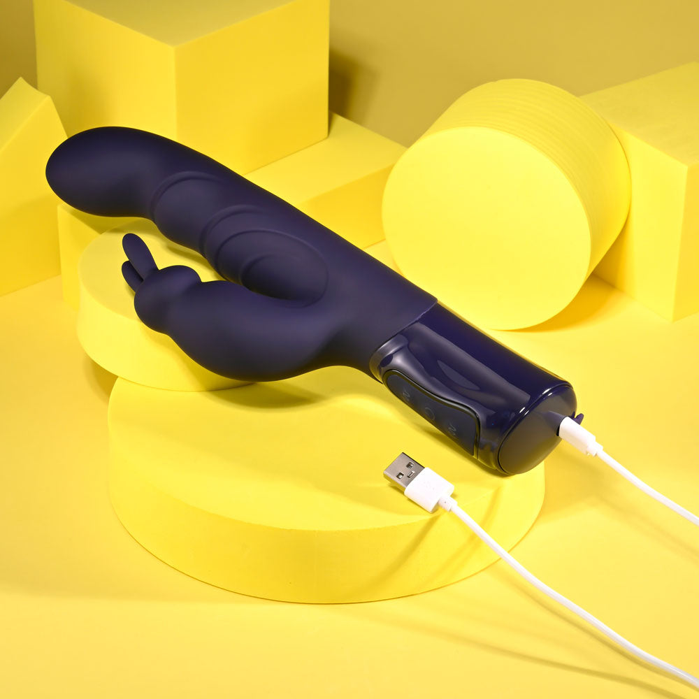 Evolved BIG DEAL - 25.7 cm USB Rechargeable Rabbit Vibrator on yellow backdrop, highlighting its sleek design and charging capability.