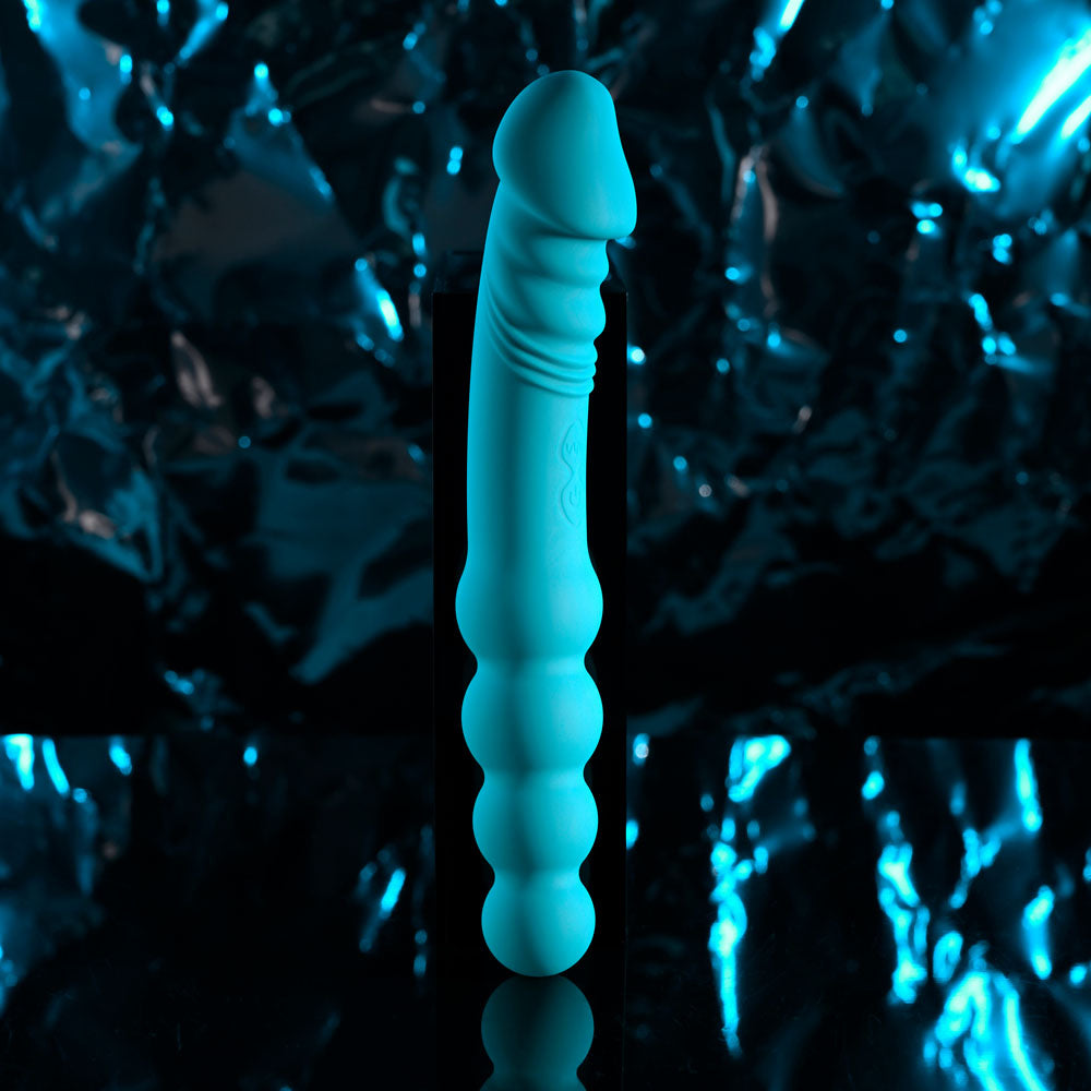Evolved FLIP FLOP - 23.1 cm USB Rechargeable Dual Ended Vibrator against a shiny reflective background.