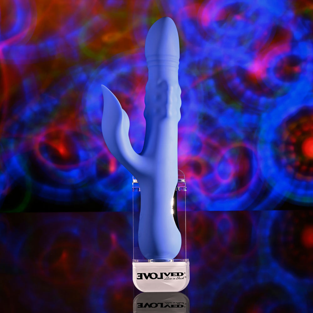 Evolved POP GOES THE O - 24.7 cm USB Rechargeable Thrusting & Bulging Rabbit Vibrator against colorful background.