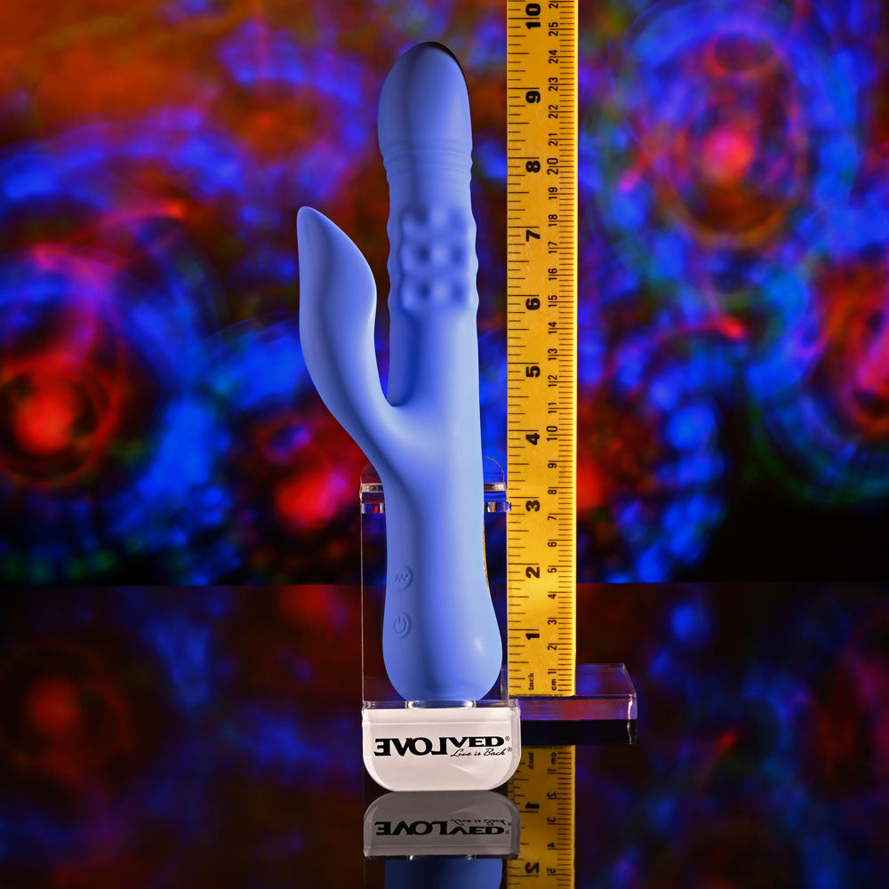 Evolved POP GOES THE O -  24.7 cm USB Rechargeable Thrusting & Bulging Rabbit Vibrator with vibrant background.