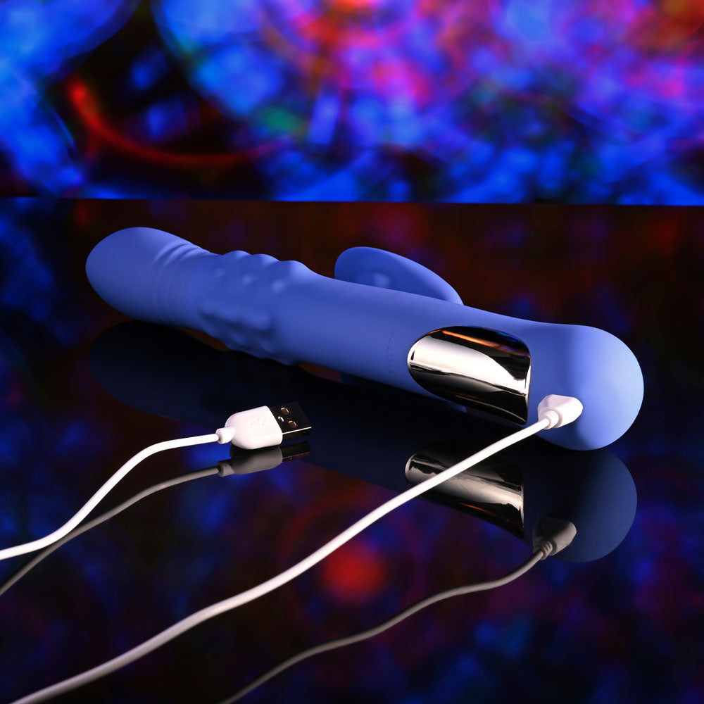 Evolved POP GOES THE O -  24.7 cm USB Rechargeable Thrusting & Bulging Rabbit Vibrator charging on a sleek surface.