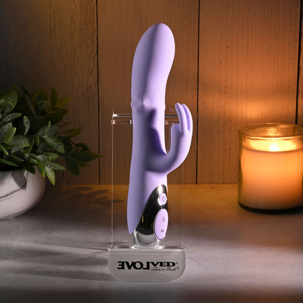 Evolved SPINDERELLA - USB Rechargeable Rabbit Vibrator displayed with soft lighting and plants for intimate essentials.