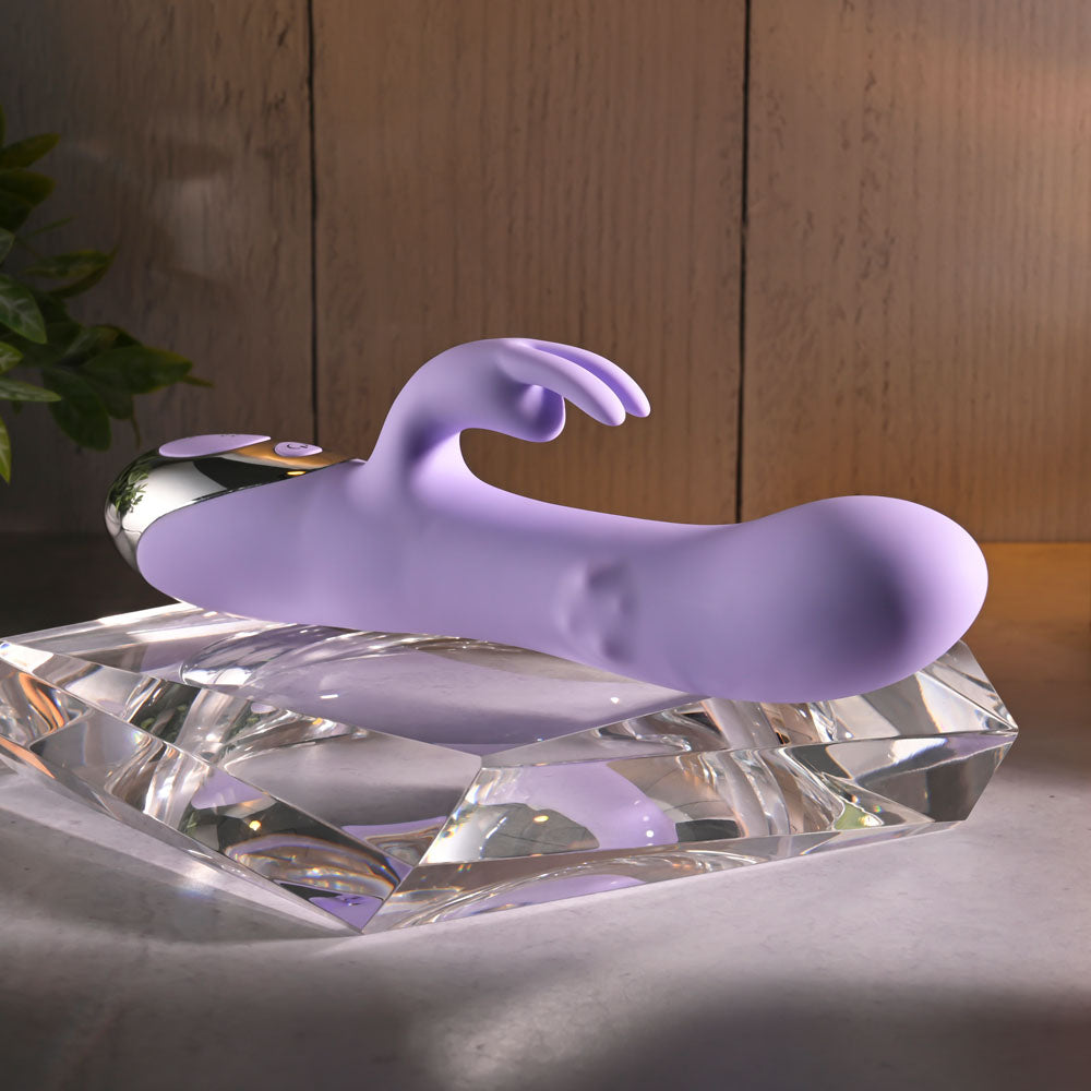 Evolved SPINDERELLA -  USB Rechargeable Rabbit Vibrator displayed on a crystal-like surface, showcasing its sleek design.