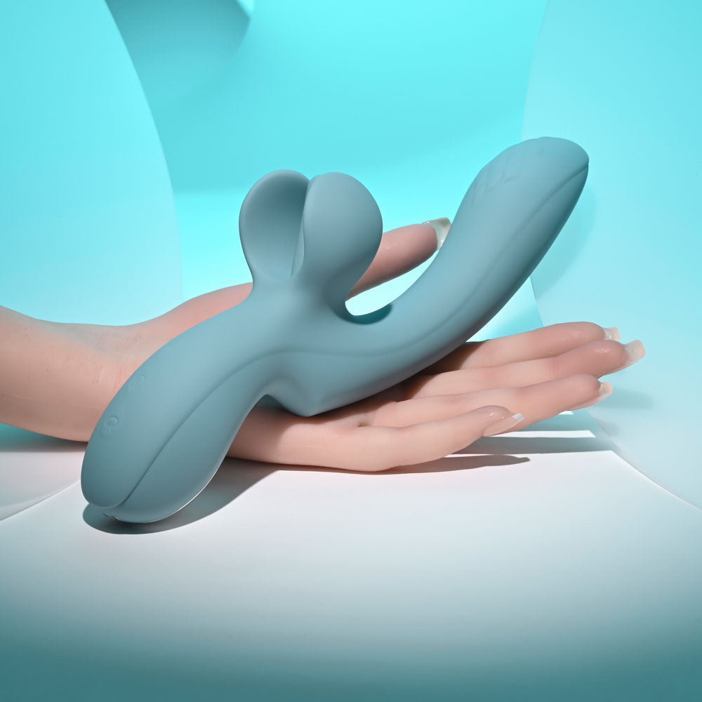 Evolved TAKE YOUR FLICK - Grey 24.1 cm USB Rechargeable Vibrator with Flicking Clitoral Stimulator on a hand.