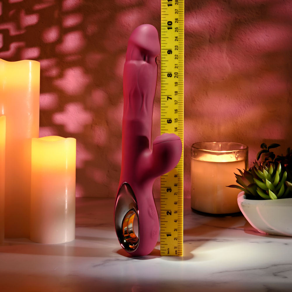 Evolved BURSTING WITH PLEASURE - 25.4 cm USB Rechargeable Vibrator with Tapping Clitoral Stimulator next to a measuring tape.