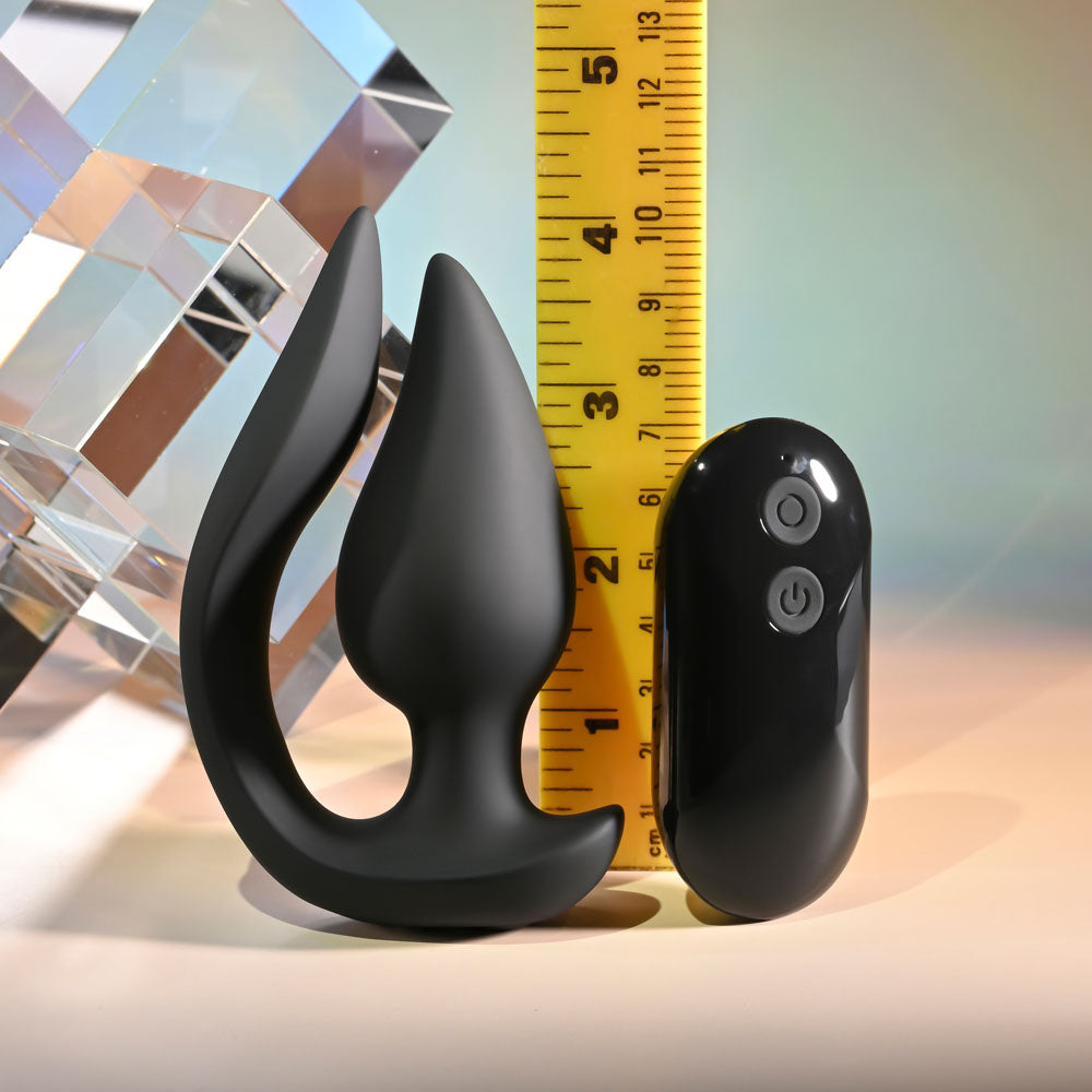 Evolved THE GENIE - 11.2 cm USB Rechargeable Vibrating Plug with Wireless Remote next to a ruler for size comparison.