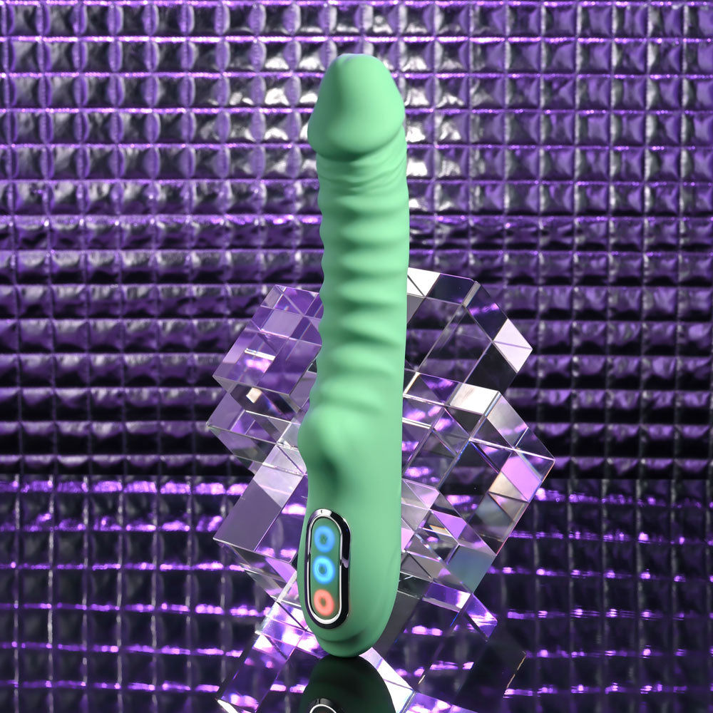 Evolved FULL THROTTLE - Mint 24.1 cm USB Rechargeable Vibrator on a reflective surface with a purple background.