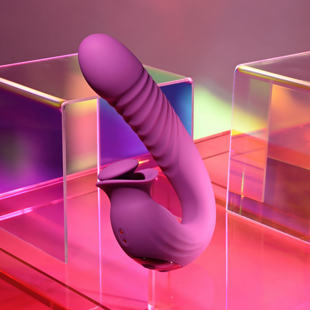 Evolved DEEP ECSTASY - 16.5 cm USB rechargeable thrusting vibrator on colorful background.