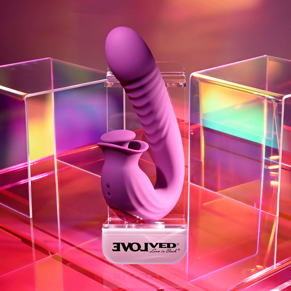 Evolved DEEP ECSTASY -  16.5 cm USB Rechargeable Thrusting and Tapping Vibrator on display with colorful background