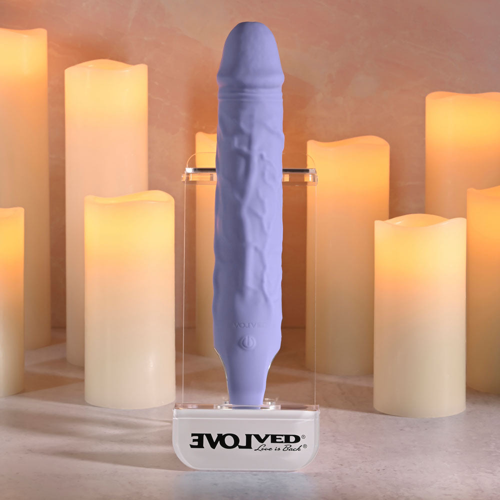 Evolved LARGE FANTASY - 21.8 cm USB Rechargeable Vibrator displayed with glowing candles.