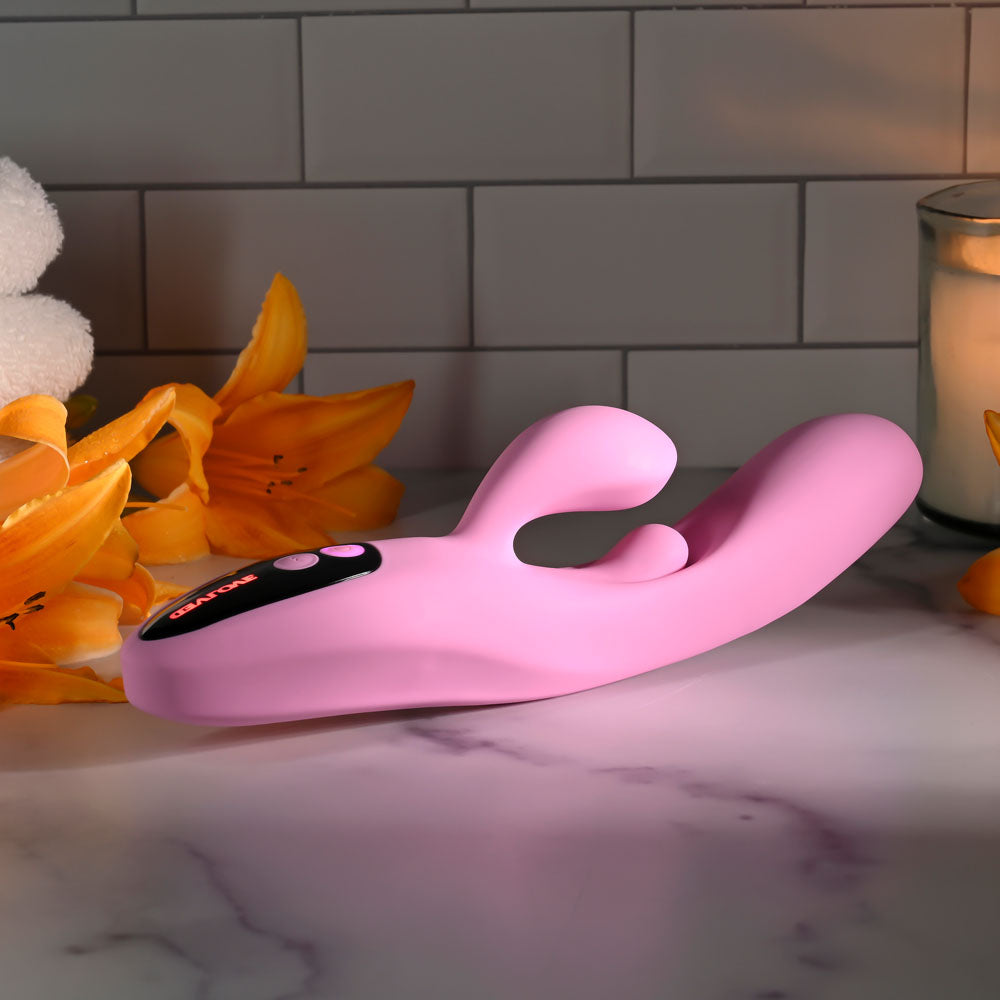 Evolved PUSH THE BUTTON - 23.5 cm USB Rechargeable Rabbit Vibrator with G-Spot Bud on a marble surface with flowers.