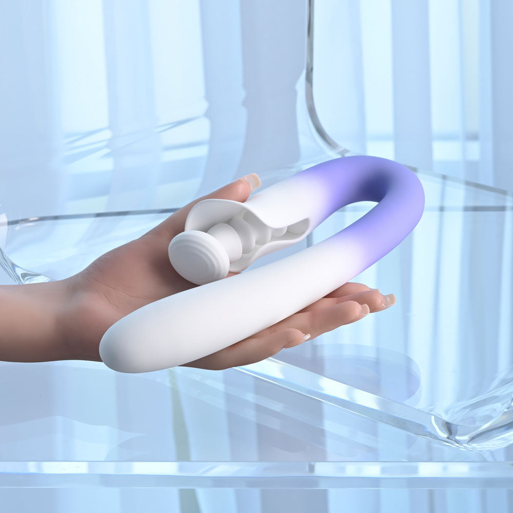 Evolved SPRING LOADED - /Purple 23 cm USB Rechargeable Multi-Tapping Vibrator in hand, showcasing its unique design and features.