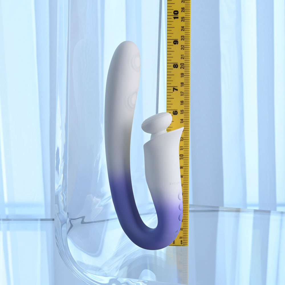 Evolved SPRING LOADED - /Purple 23 cm USB Rechargeable Multi-Tapping Vibrator next to measuring tape for size reference.