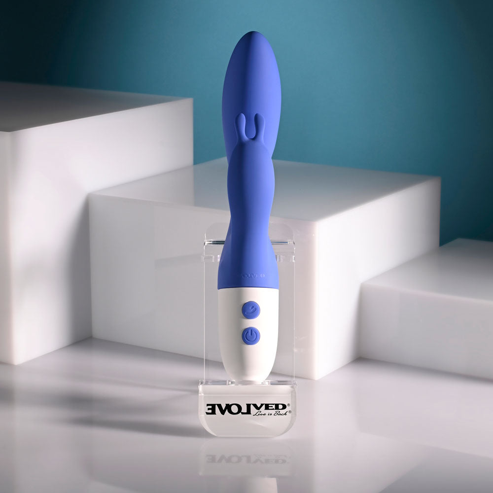 Evolved FUNNY BUNNY - 20 cm USB Rechargeable Rabbit Vibrator displayed on a stand, showcasing its sleek design and buttons.