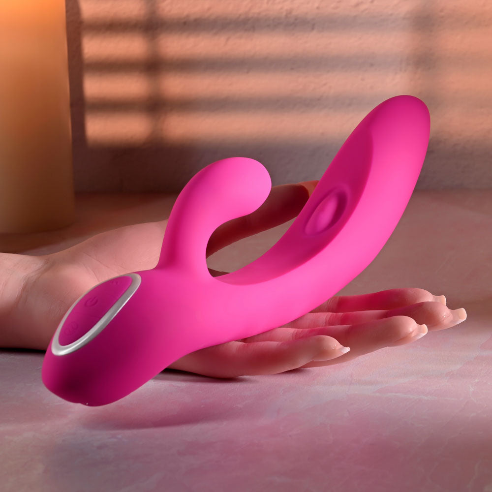 Evolved G-TAPPER -  USB Rechargeable Rabbit Vibrator displayed on a hand, showcasing its flexible design and vibrant pink color.