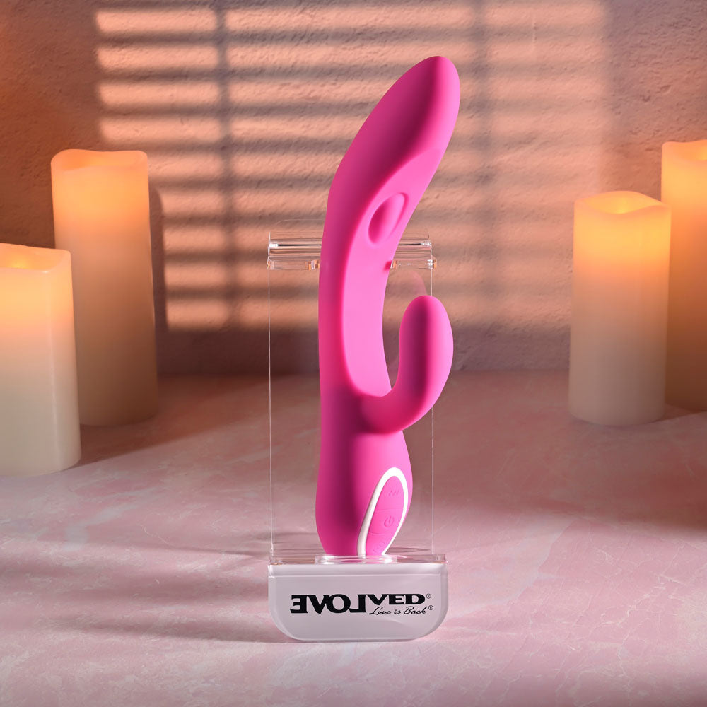 Evolved G-TAPPER - USB Rechargeable Rabbit Vibrator displayed against a soft glow of candles.