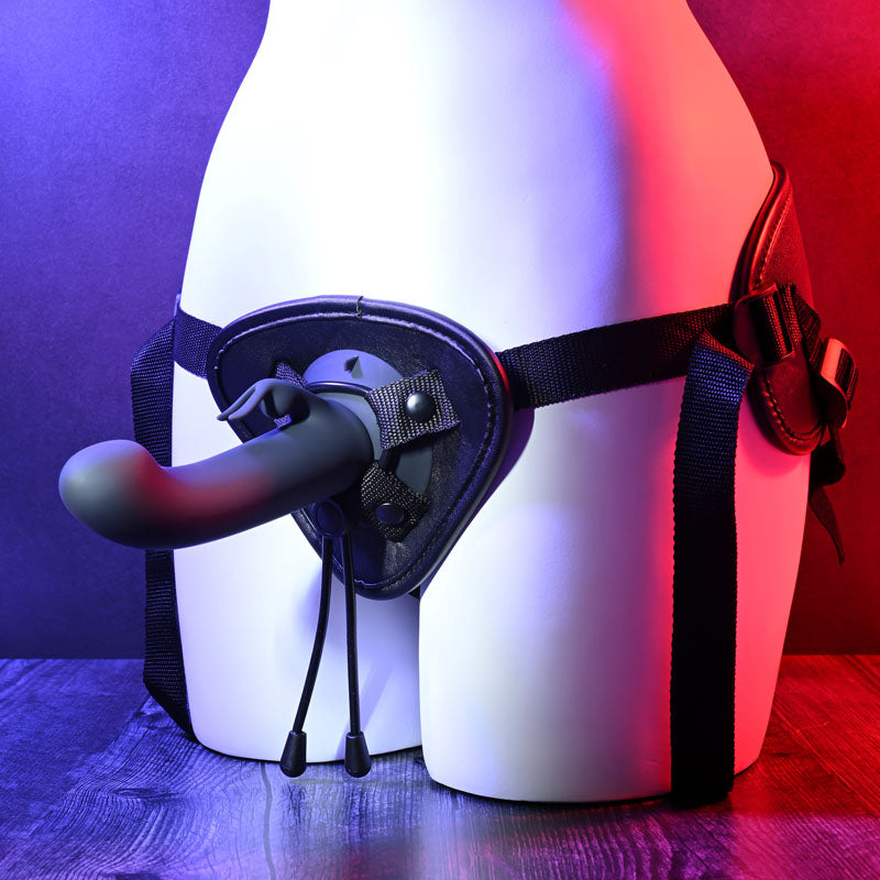 Evolved HEAVENLY HARNESS -  USB Rechargeable Strap-On Kit displayed on a mannequin with vibrant lighting.