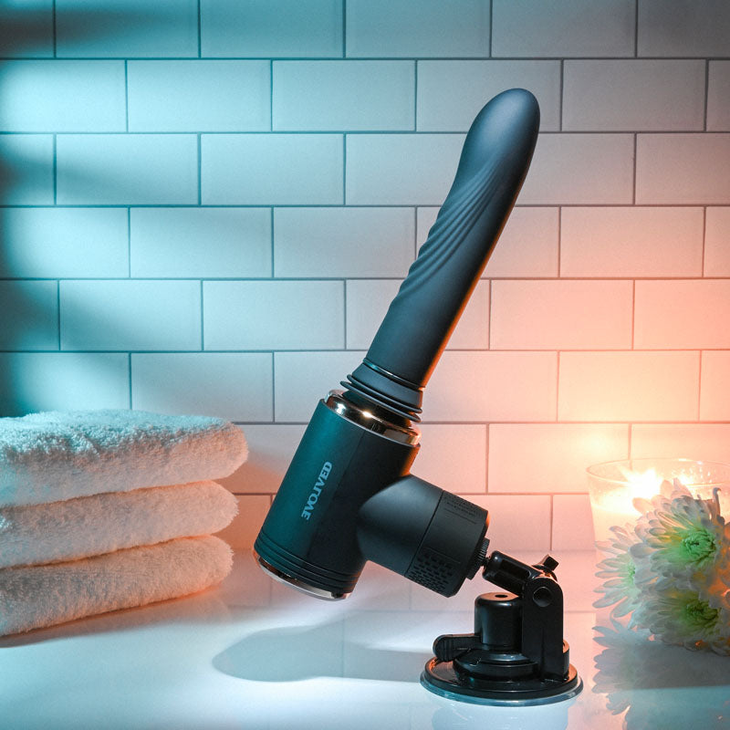 Evolved TOO HOT TO HANDLE -  USB Rechargeable Thrusting Vibe with Stand in a serene bathroom setting.
