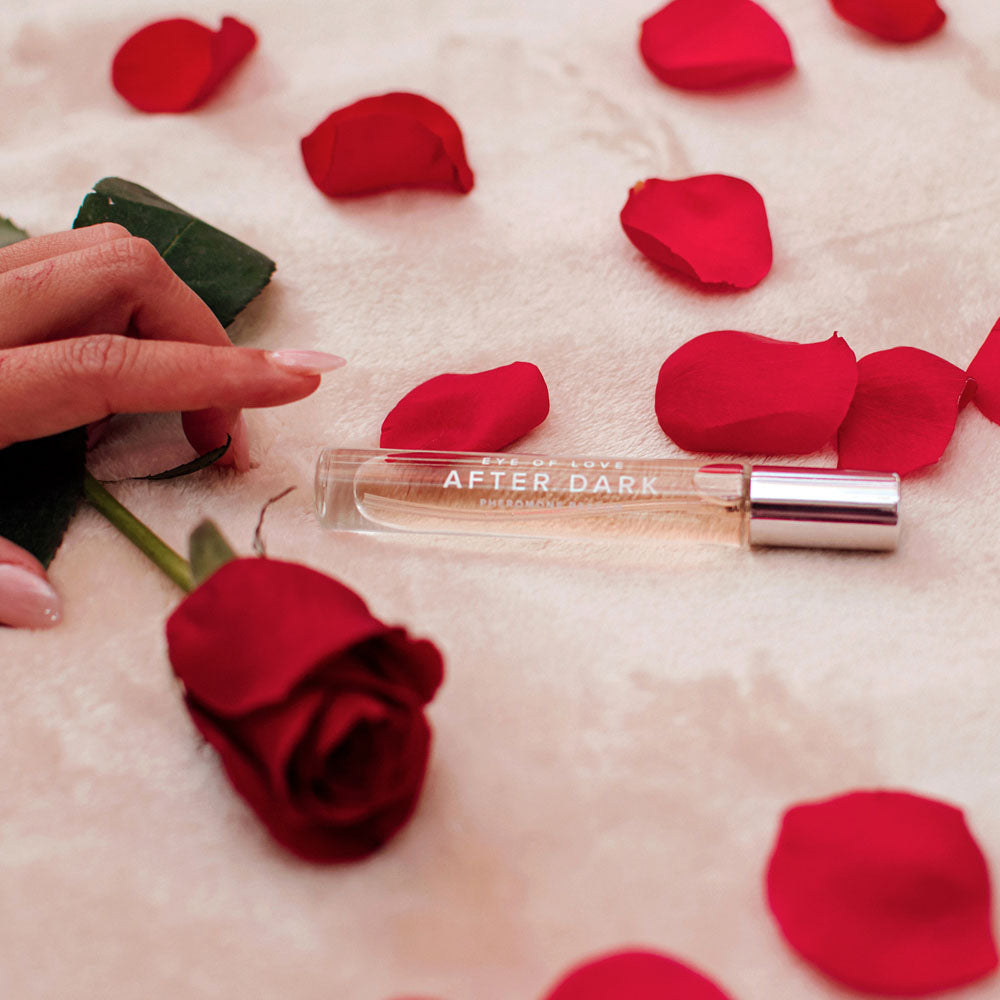 Eye Of Love After Dark Pheromone Perfume - 10 ml - Coco Vanilla Scented Pheromone Perfume for Women to attract Men - 10 ml Spray on a bed of rose petals.