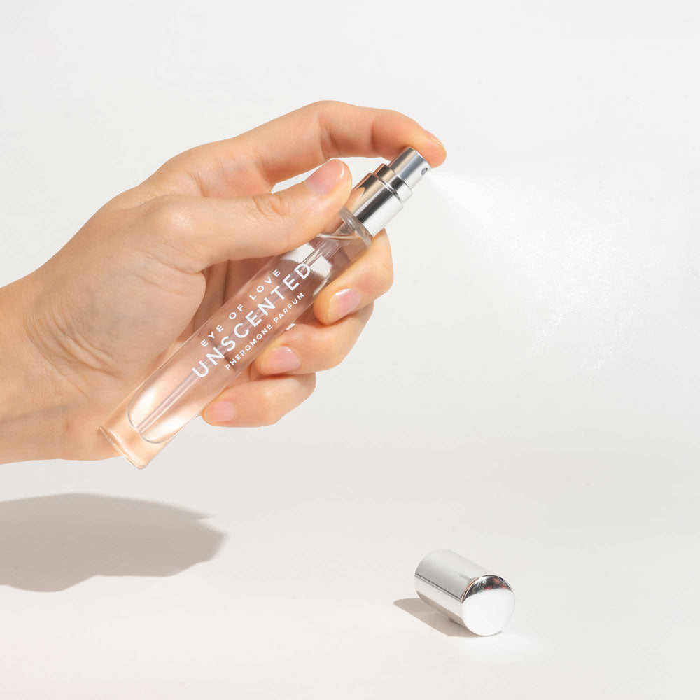 Eye Of Love Unscented Pheromone Perfume - 10 ml - Unscented Pheromone Perfume for Women to attract Men - 10 ml Spray being sprayed.