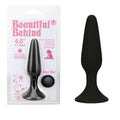 Beautiful Behind -  11.5 cm Butt Plug with suction cup base and smooth silicone tip in packaging.