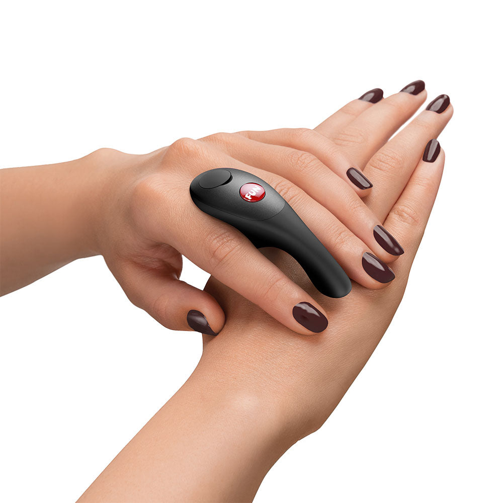 Fun Factory BE-ONE  -  USB-C Rechargeable Finger Stimulator on a hand, showcasing its ergonomic design for intimate essentials.