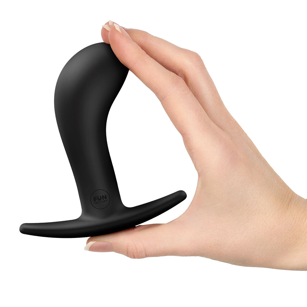 Fun Factory BOOTIE L  -  10.9 cm Large Anal Plug held in hand, showcasing its sleek design for intense satisfaction.