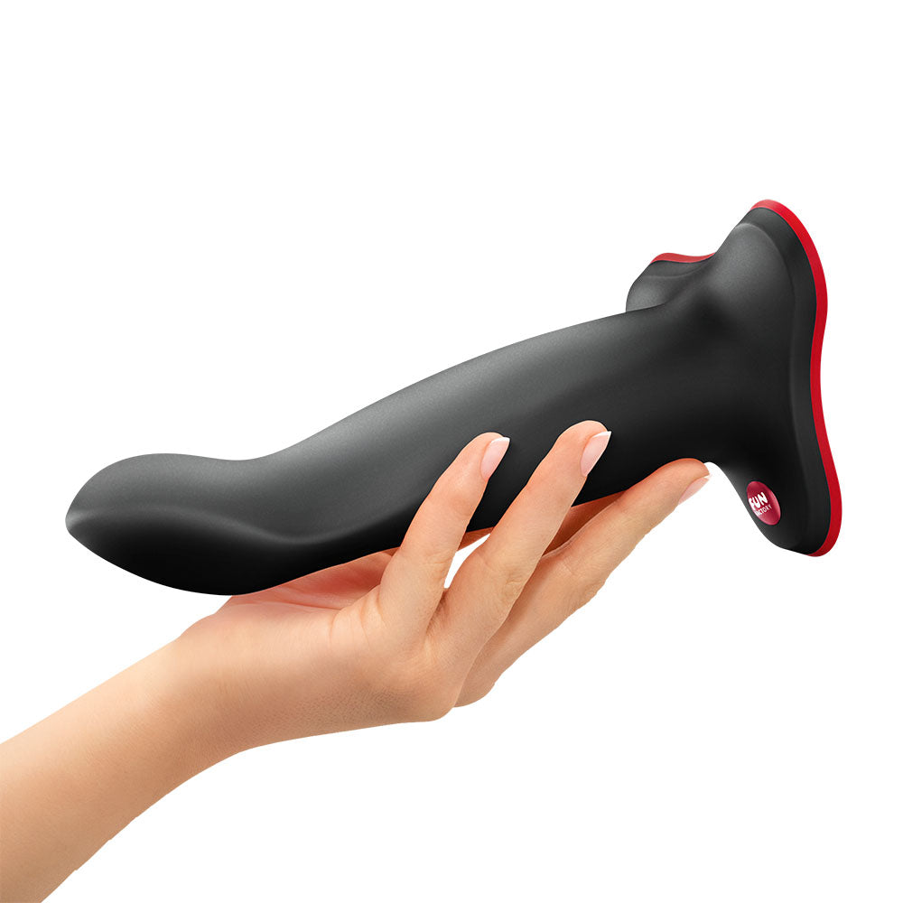 Fun Factory LIMBA FLEX L - 17.8 cm Dildo held in hand showcasing its versatile design for intimate essentials.